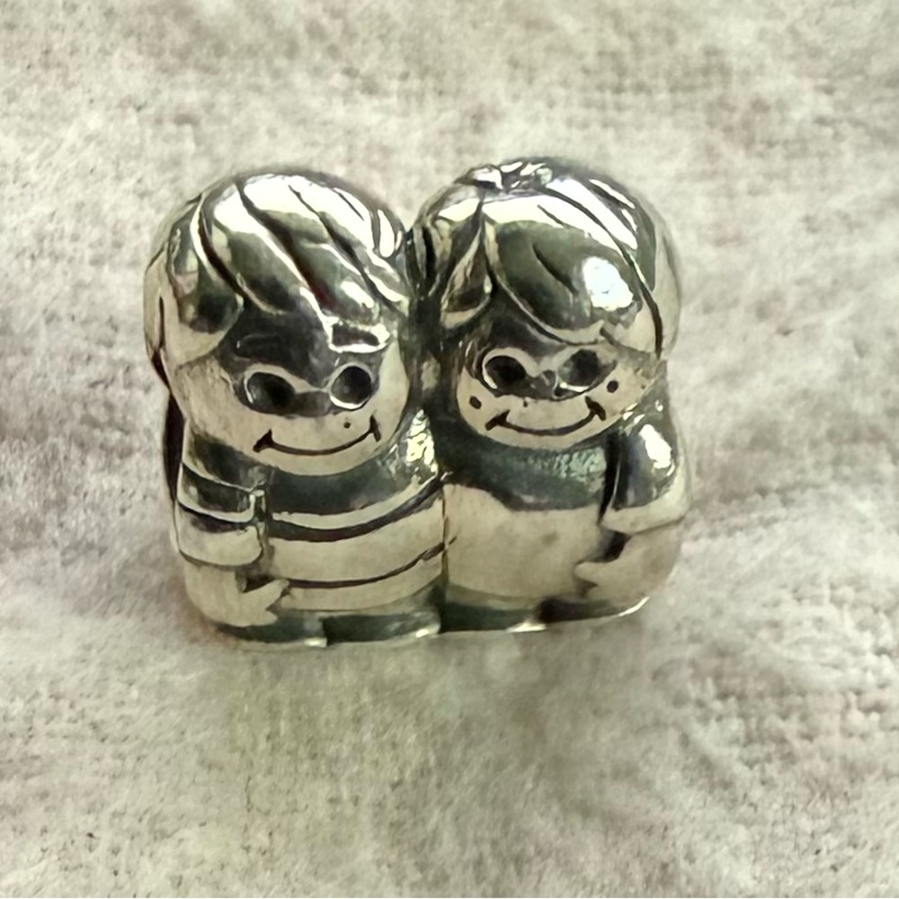Camilia brothers charm
